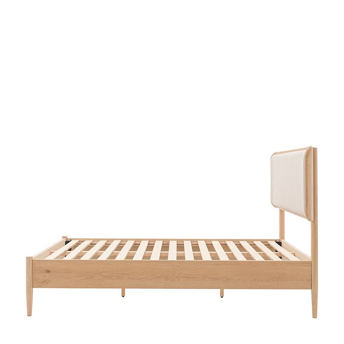 side on image of oak slatted bed without mattress, cut out on white background