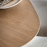 close up on smooth curved edge of light oak dining table
