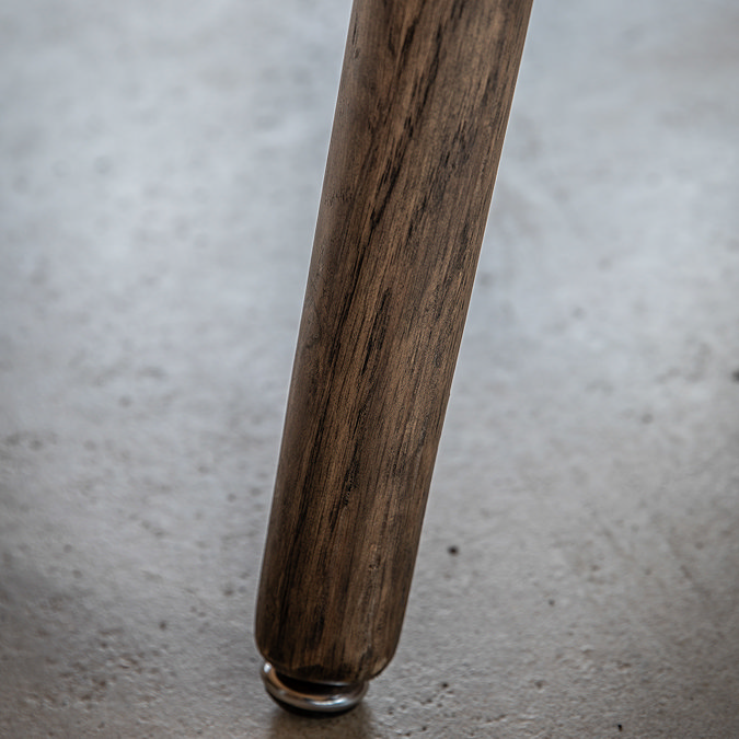 close up image of dark smoked oak veneer leg of dining table
