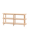 image cut out on white background of wide oak shelving unit with four shelves