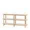 image cut out on white background of wide oak shelving unit with four shelves