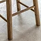 close up on wooden legs with slats of oak stool
