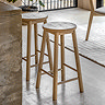 image of light oak wood stool with round seat and four legs