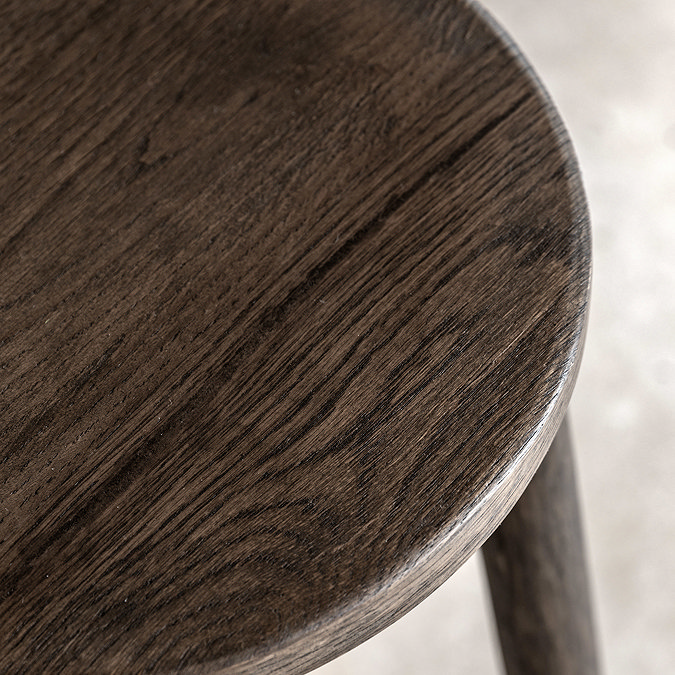 close up image of smoked oak seat top of bar stool