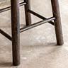 close up image of feet of smoked oak wooden bar stool
