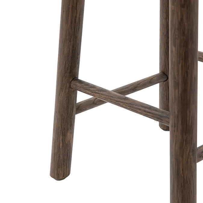 close up image of wooden legs of smoked oak bar stool