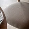close up on light grey fabric of upholstered dining chair seat
