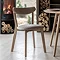 oak frame dining chair with upholstered grey seat and gently curved backrest