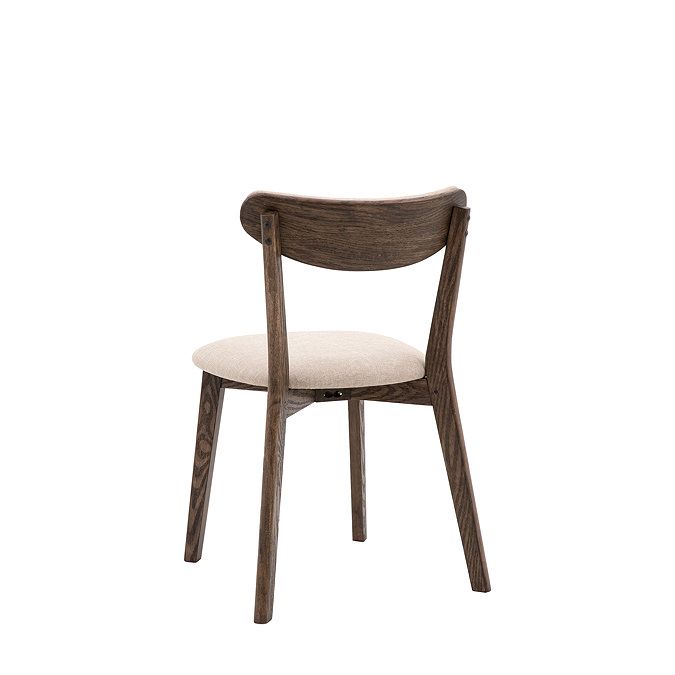 back image cut out on white background of dark wood dining chair with padded seat and curved backrest