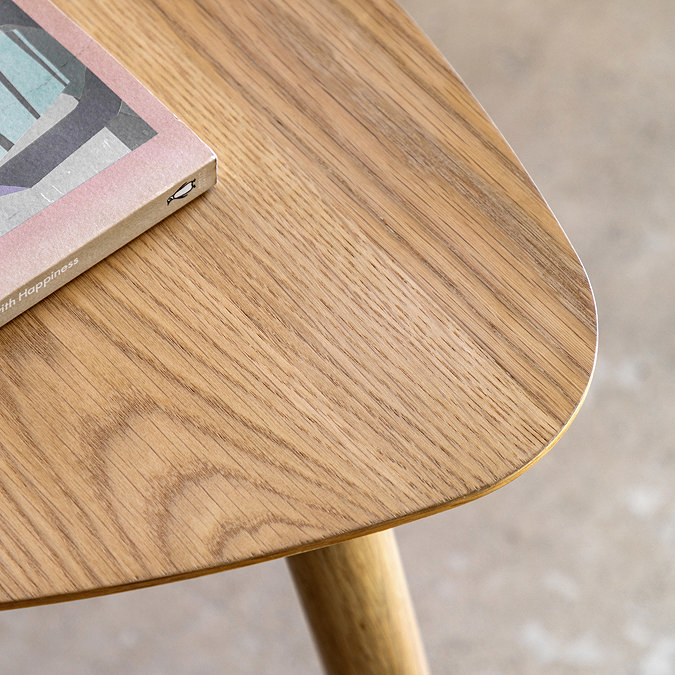 close up on wooden top of side table in oak colour