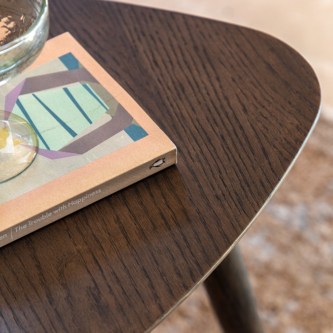 close up image of smoked oak triangular tabletop
