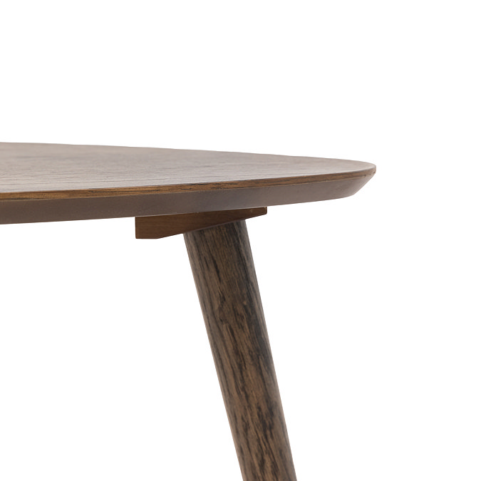 close up image cut out on white background of dark oak triangular side table