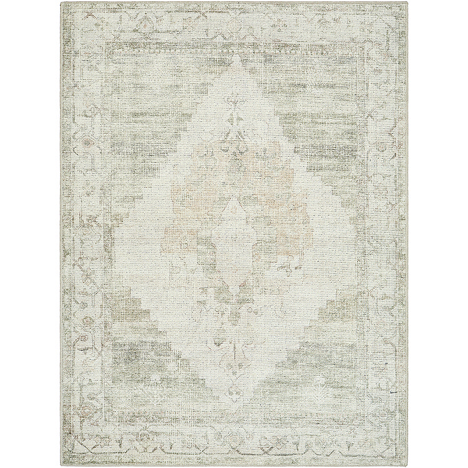 image cut out on white background of olive green rug with faded floral patterns and central diamond