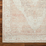 close up image of tan and ivory vintage rug, focus on colours and textures