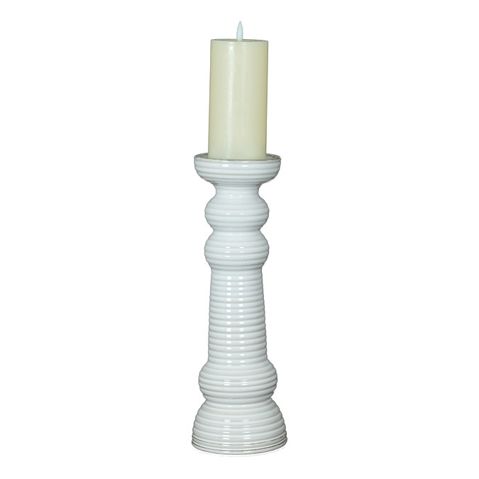 image cut out on white background of ribbed ceramic pillar candle holder