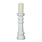 image cut out on white background of ribbed ceramic pillar candle holder