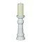 image cut out on white background of medium sized ceramic ribbed candle holder with battery operated candle