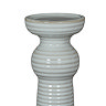 close up image cut out on white background of ceramic ribbed candle holder without candle to show top