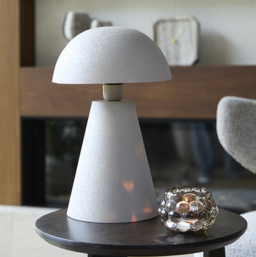 image cut out on white background of light grey matt domed lamp