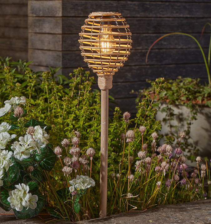 image of faux rattan stake light with top shaped like beehive
