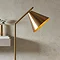 image of conical head of tall slim lamp with diagonal adjustable head 