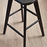close up on legs of black oak bar stool
