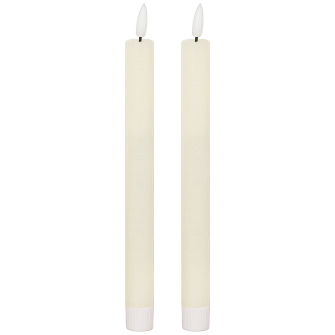 image cut out on white background of pair of ivory LED dinner candles