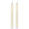 image cut out on white background of pair of ivory LED dinner candles