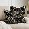 Audrey 55x55cm cushion in black lifestyle image 3