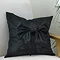 Luxury Bow Cushion in black on chair image 1
