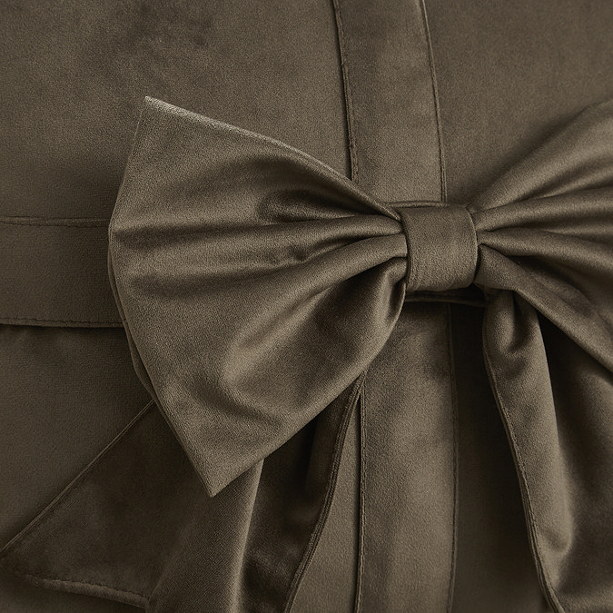 close up image on bow detail on front of chocolate brown velvet cushion