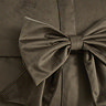 close up image on bow detail on front of chocolate brown velvet cushion