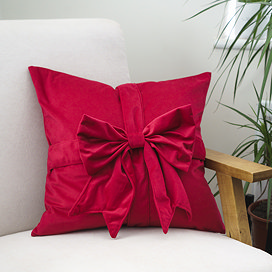 Red Bow cushion on chair image 1