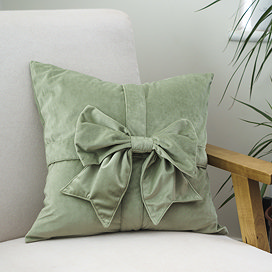Sage Bow cushion on chair image 1