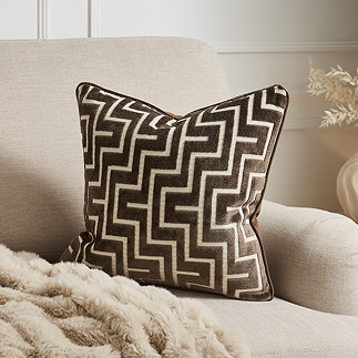 Geo chocolate brown cushion on settee image 1