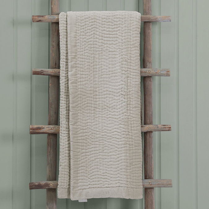 Quartz Luxury Haze Throw Draped Over Wooden Rail