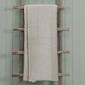 Quartz Luxury Haze Throw Draped Over Wooden Rail