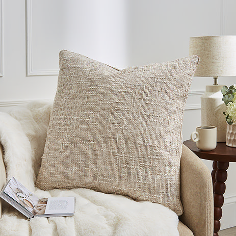 Isabella textured slub natural cushion on settee image 1