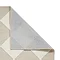 image of white and beige checkered rug folded over in corner to show floor-facing material