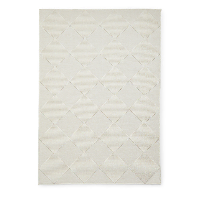 image cut out on white background of cream checkered rug
