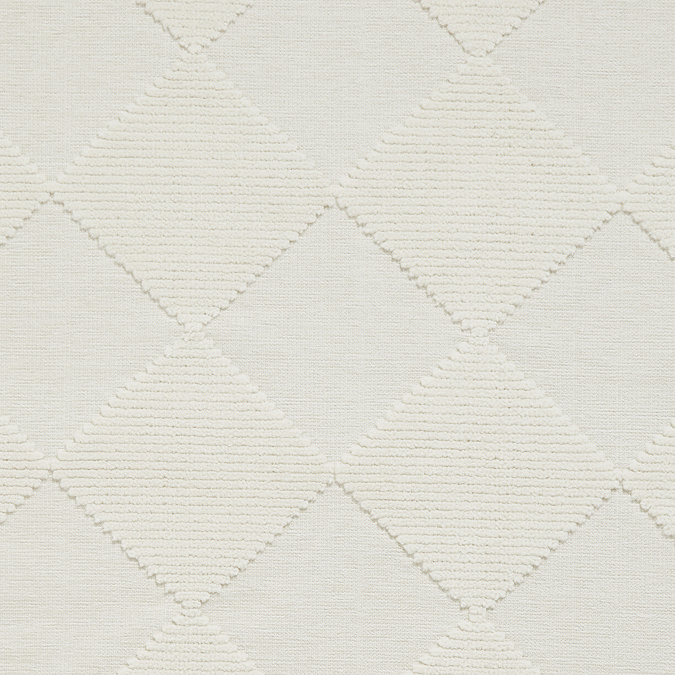 close up on cream checkered pattern of rug