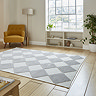 angled image of cream and grey checkered diamond rug
