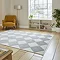 angled image of cream and grey checkered diamond rug