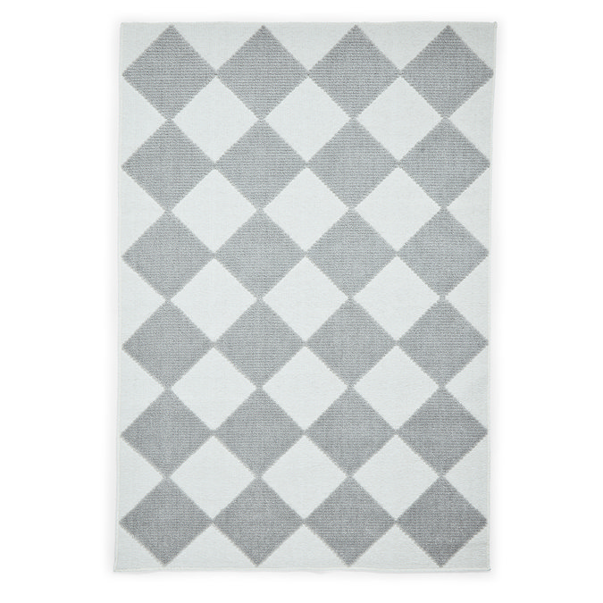 image cut out on white background of cream and grey diamond checkerboard rug