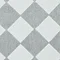 close up image of cream and grey checkerboard rug