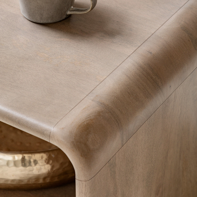 close up image of smooth rounded corner of mango wood coffee table