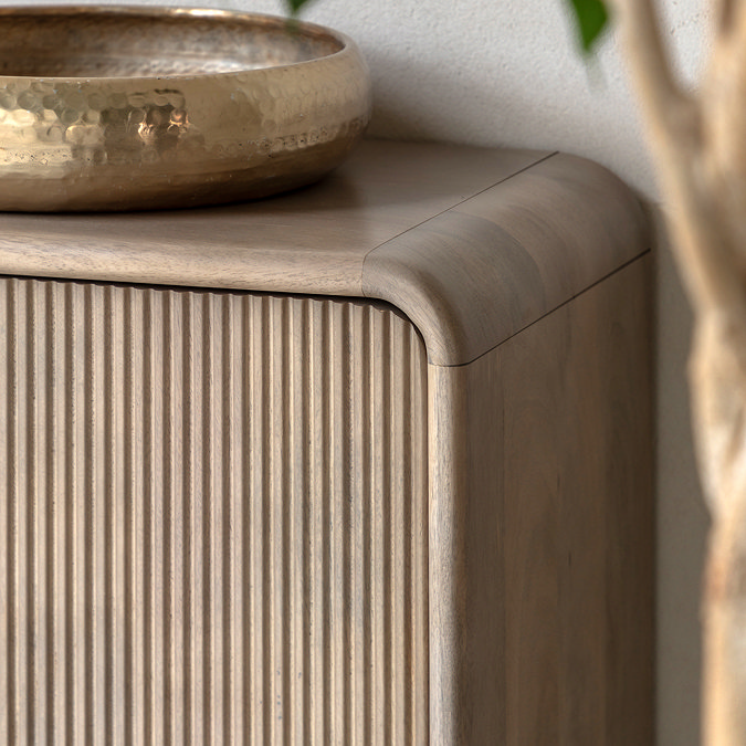 close up image of fluted doors on mango oak sideboard