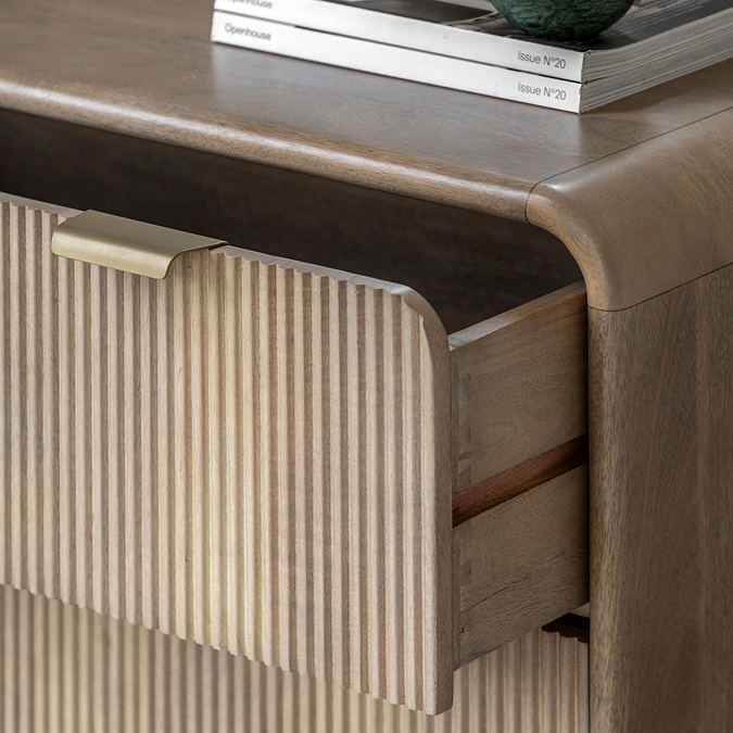 close up on fluted mango wood drawer slightly open to reveal inner contraption, with smooth rounded edge