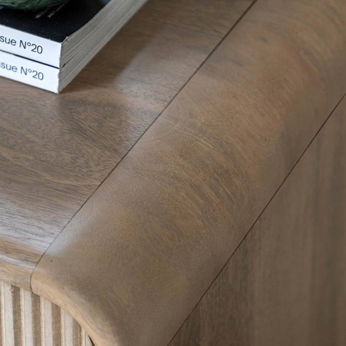 close up image of smooth rounded edge of mango wood chest