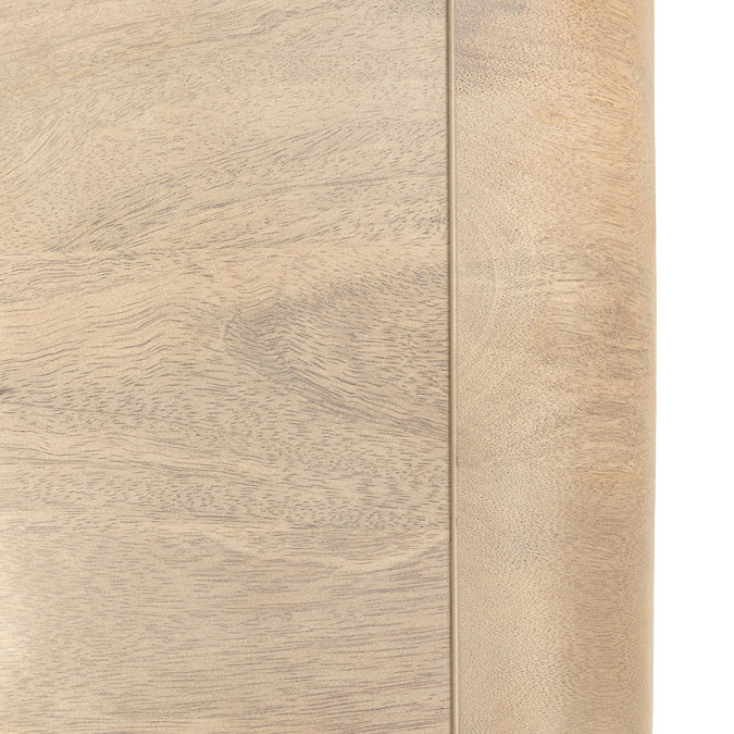 close up on wood grain of mango wood chest of drawers